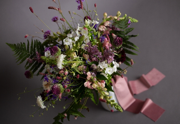 Pastel colour flowers on a grey background