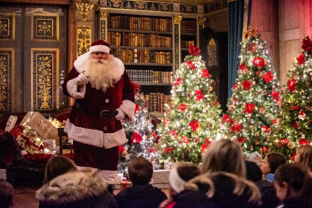 Santa surrounded by children